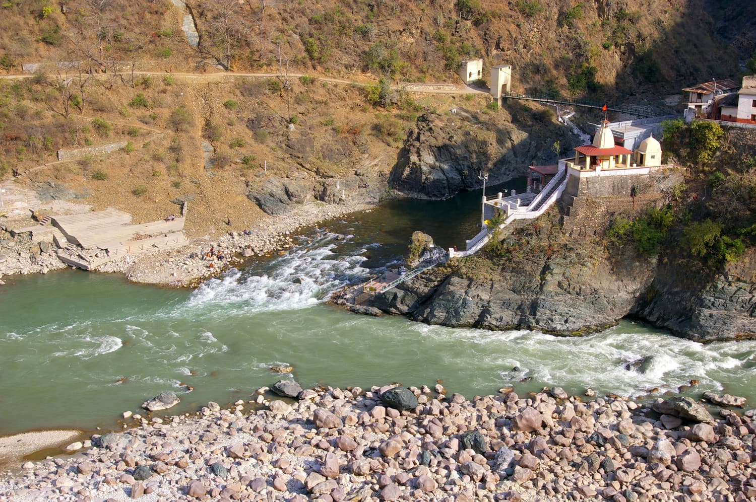 The Alaknanda and Mandakini rivers meeting below a small temple at Rudraprayag