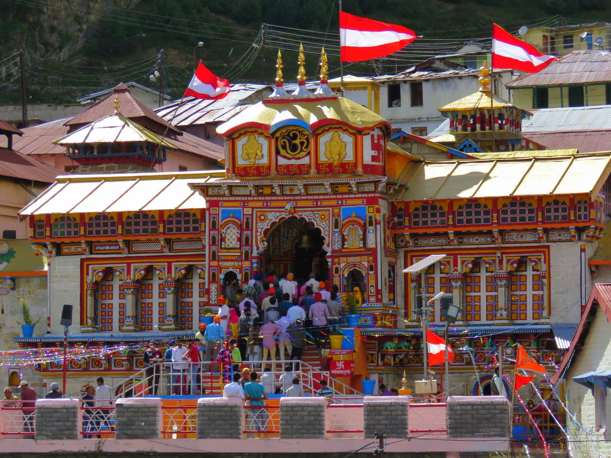Pilgrims on the steps of the brightly painted Badrinath temple