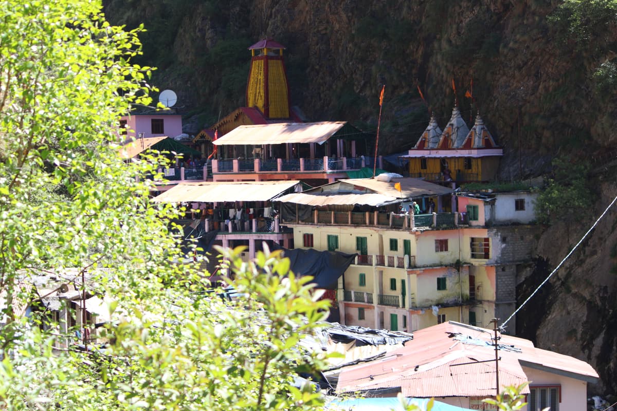 The Yamunotri shrine and its guesthouses tucked under a cliff